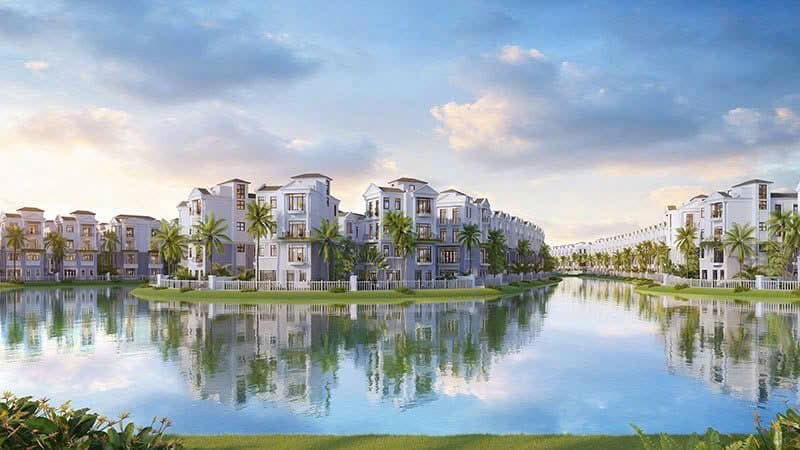 Phối cảnh dãy biệt thự Đảo Ngọc soi bóng bên mặt nước lúc hoàng hôn